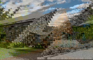 Foto 1 - Rustic Holiday Home with Sauna & Hot Tub in Wooded Area