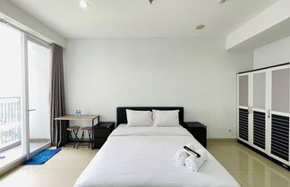 Photo 2 - Cozy Studio Room At Dago Suites Apartment