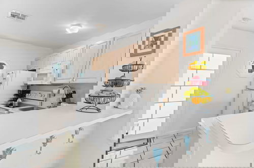 Photo 9 - Coral Breeze by Avantstay Close to Beach w/ Balcony & Shared Pool! Month Long Stays Only