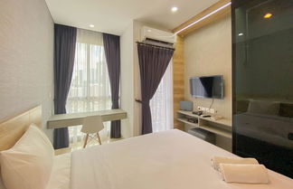 Foto 1 - Elegant And Homey Studio Ciputra World 2 Apartment