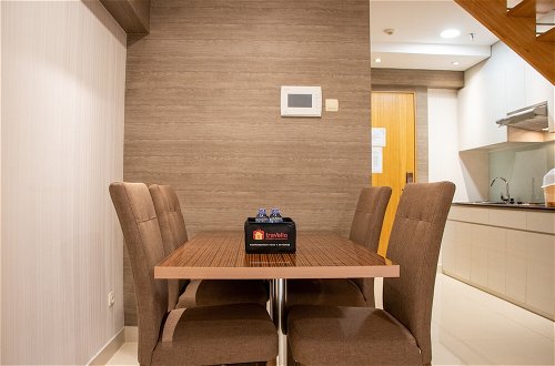 Photo 10 - Comfort 2Br Loft Apartment At Maqna Residence