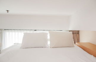 Photo 1 - Fancy and Nice Studio Room Apartment at Nine Residence