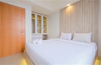 Photo 2 - Minimalist 1Br With Extra Room At Evenciio Margonda Apartment