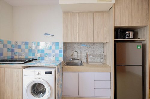 Photo 12 - Minimalist 1Br With Extra Room At Evenciio Margonda Apartment