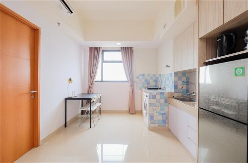 Photo 17 - Minimalist 1Br With Extra Room At Evenciio Margonda Apartment