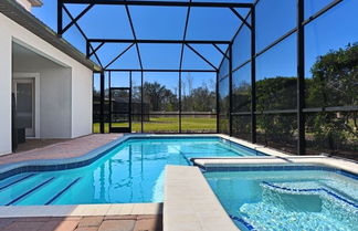 Photo 1 - Champions Gate Near Disney Privacy In Back! 6 Bedroom Home by RedAwning