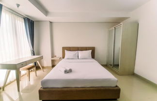 Photo 2 - Cozy Studio Room At Barsa City Apartment