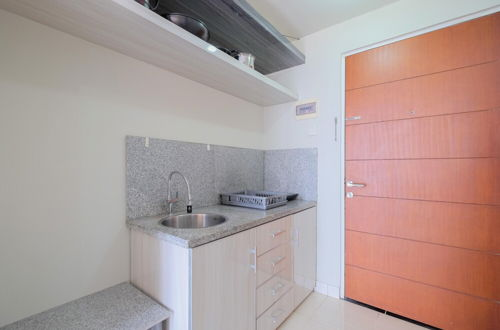 Foto 7 - Homey And Warm Studio Room At Taman Melati Margonda Apartment