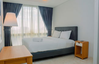 Photo 3 - Comfy and Spacious 2BR The Masterpiece Epicentrum Apartment By Travelio