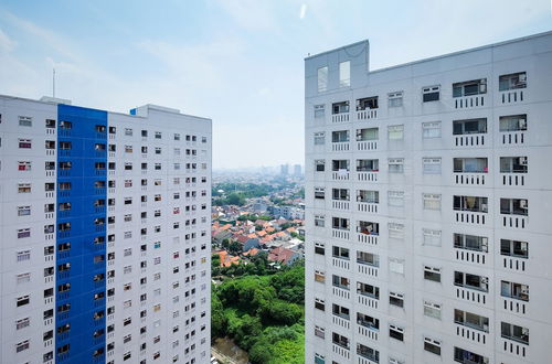 Photo 30 - Homey 1BR with Spacious Living Room and Sofa Bed Green Pramuka Apartment