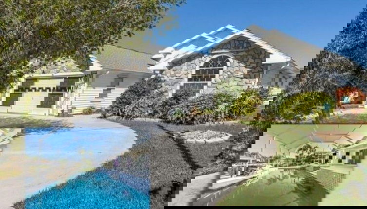 Photo 1 - Peaceful Waterfront Pool Home 3 Bedroom Home by RedAwning