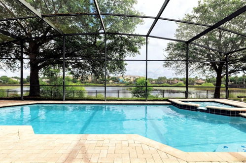 Photo 1 - Lakefront 6BR Villa w Pool SPA 2 Miles to Disney