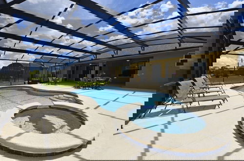 Photo 12 - Gorgeous 5bd Gm Spa Pool Hm Watersong-318ys 5 Bedroom Home by RedAwning