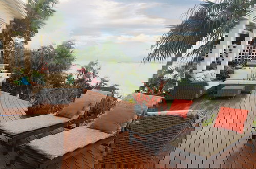 Foto 10 - Touch Of Class Cottage: Beachfront Oasis