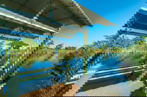 Photo 12 - Canal Dreams 3 BR 2 BA Pool Home on the Canal