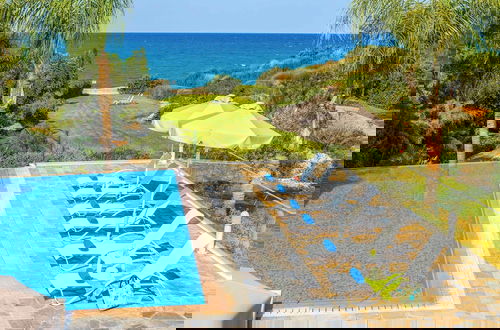 Foto 32 - Harmonia Beach Villa
