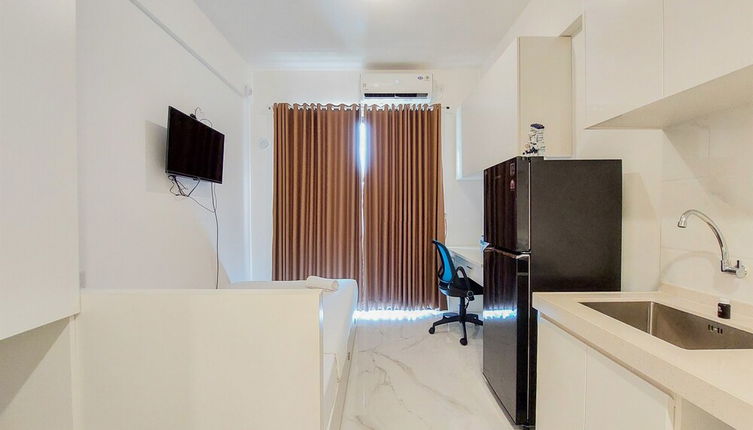 Photo 1 - Cozy Living Studio Room At Sky House Bsd Apartment