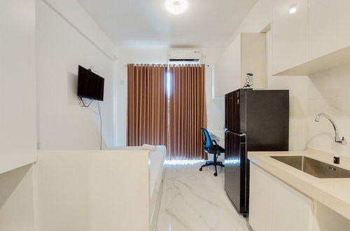 Photo 1 - Cozy Living Studio Room At Sky House Bsd Apartment