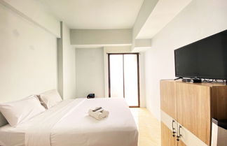 Photo 3 - Cozy Studio Room At Tamansari Panoramic Apartment