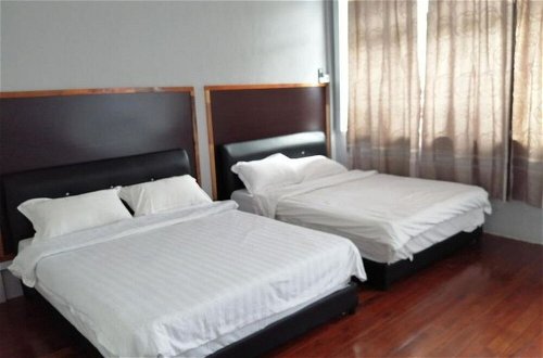Foto 5 - Comfortable Family Room for 4 People in Kuching With Ac - Amida Point Services