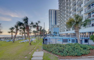 Photo 1 - Oceanfront Boardwalk Condo w Private Balcony & Close to the Beach