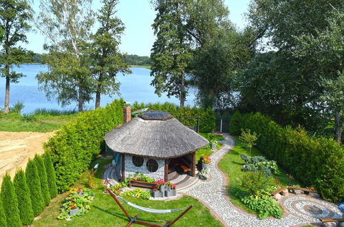 Photo 31 - A Luxury Home on the Shore of the Lake. Living Room With Fireplace, 2 Bedrooms