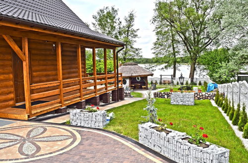 Photo 27 - A Luxury Home on the Shore of the Lake. Living Room With Fireplace, 2 Bedrooms