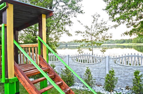 Photo 29 - A Luxury Home on the Shore of the Lake. Living Room With Fireplace, 2 Bedrooms