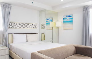 Photo 2 - Nice And Comfort Studio Room At Azalea Suites Apartment