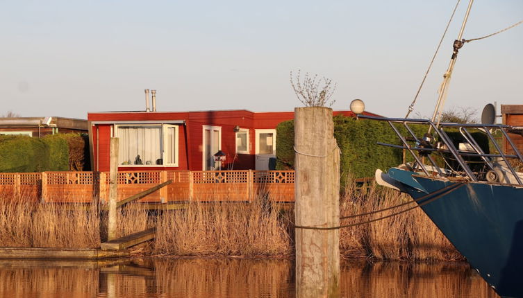 Photo 1 - 4 Pers. Holiday Chalet Gaby With Fishing Spot and Insauna at Lake Lauwersmeer
