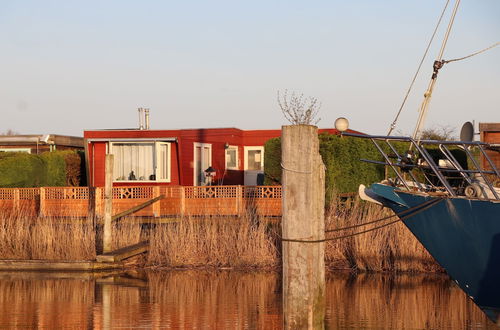 Photo 1 - 4 Pers. Holiday Chalet Gaby With Fishing Spot and Insauna at Lake Lauwersmeer