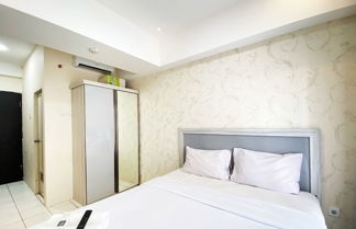 Photo 2 - Comfy Studio Room At Grand Asia Afrika Apartment