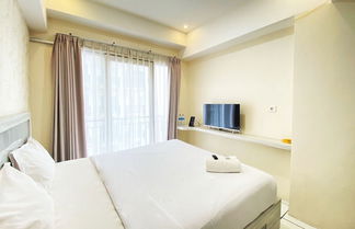 Photo 3 - Comfy Studio Room At Grand Asia Afrika Apartment