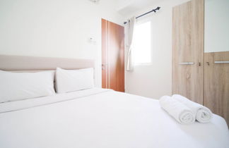 Photo 1 - Cozy Living And Tidy 2Br At Puncak Dharmahusada Apartment