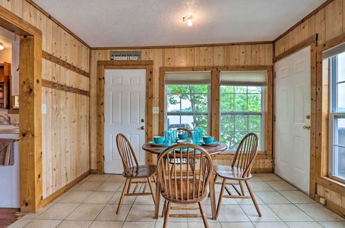 Photo 4 - Lakefront Ozark Cottage: Deck w/ Covered Dock