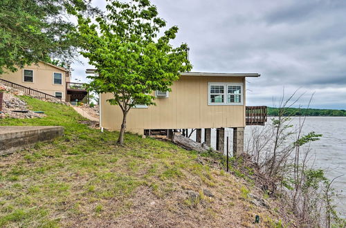 Photo 16 - Lakefront Ozark Cottage: Deck w/ Covered Dock