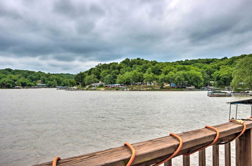 Photo 15 - Lakefront Ozark Cottage: Deck w/ Covered Dock