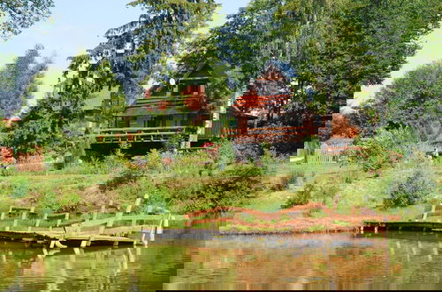Photo 14 - Rustic Riverside Cabin in Forest