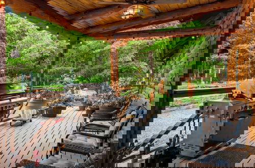 Photo 60 - The Bigwood Cabin by Avantstay Hot Tub, Firepit, Pool Table, Private Yard