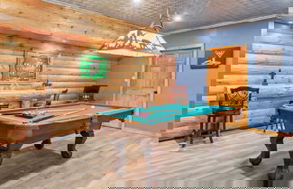 Photo 2 - The Bigwood Cabin by Avantstay Hot Tub, Firepit, Pool Table, Private Yard