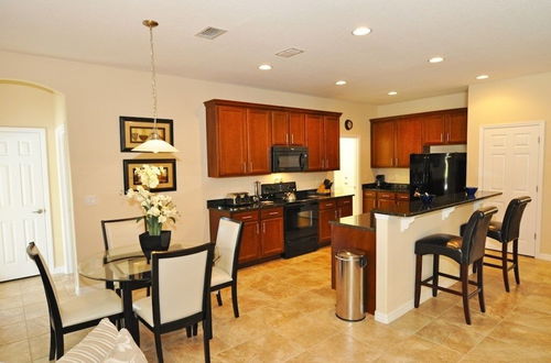 Photo 8 - Beautiful Pool/spa & Game Room Near Disney! 5 Bedroom Home by RedAwning