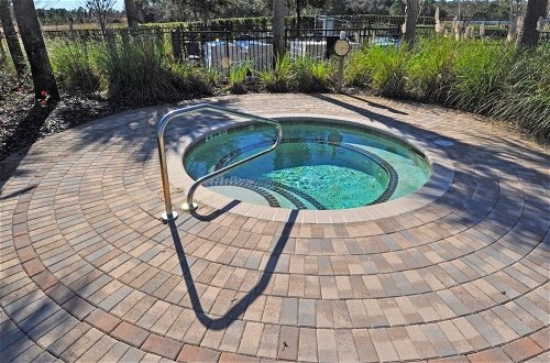Photo 16 - Beautiful Pool/spa & Game Room Near Disney! 5 Bedroom Home by Redawning