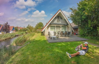 Photo 1 - 6 Pers. House With Sunny Terrace at a Typical Dutch Canal & by Lake Lauwersmeer.