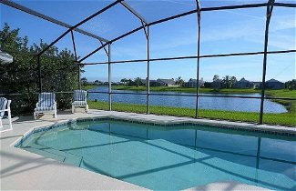 Photo 1 - 3 Bedroom Orlando Vacation Pool Home With Water View, Hot Tub, Games Room Near Disney