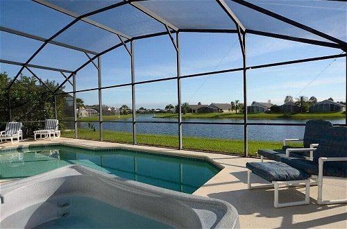 Photo 2 - 3 Bedroom Orlando Vacation Pool Home With Water View, Hot Tub, Games Room Near Disney