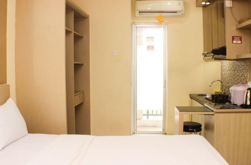 Photo 2 - Comfy And Best Location Studio Room At Bassura City Apartment