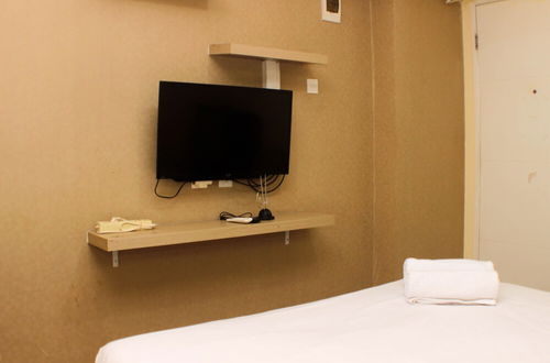 Photo 11 - Comfy And Best Location Studio Room At Bassura City Apartment