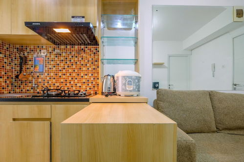 Foto 11 - Minimalist and Cozy Living 2BR at Bassura City Apartment