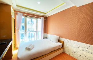 Photo 2 - Cozy Studio At Grand Asia Afrika Apartment