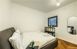Photo 2 - Stylish 3BR Apt with Patio in the City